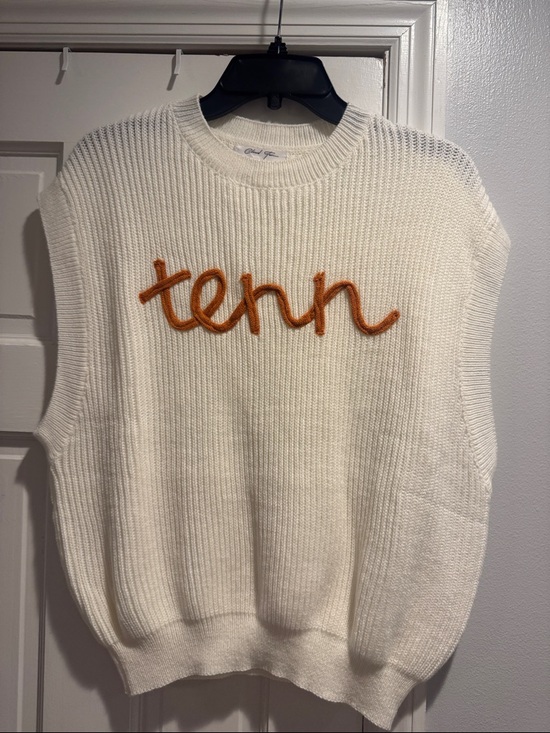 Cloud Ten Sweaters - Sleeveless Crewneck Knit Sweater in Cream with Orange Script